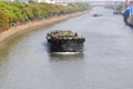 Empty barge on channel in China village