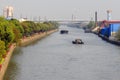 Empty barge on channel in China village