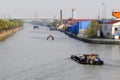 Empty barge on channel in China village