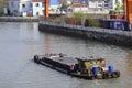 Empty barge on channel in China village