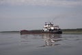 The empty barge floating on the river.