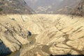 The empty basin of Verzasca dam on Switzerland Royalty Free Stock Photo