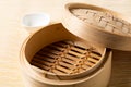 Empty basket of dim sum made by bamboo material and chopsticks. Chinese Traditional cuisine concept. Dumplings Dim Sum in bamboo Royalty Free Stock Photo