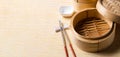 Empty basket of dim sum made by bamboo material and chopsticks. Chinese Traditional cuisine concept. Dumplings Dim Sum in bamboo Royalty Free Stock Photo
