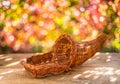 Empty basket for fruits and vegetables on an autumn sunny background with beautiful bokeh Royalty Free Stock Photo