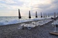 Empty beach chairs and parasols at dusk Royalty Free Stock Photo