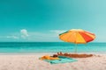 Empty beach without people with umbrella and accesorries at sea background