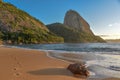 The empty beach Praia Vermelha and Sugarloaf mountain on the background Royalty Free Stock Photo