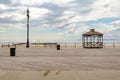 Empty Beach Promenade with Pavilion at Coney Island during sunset with ocean and cloudy Sky, NYC Royalty Free Stock Photo