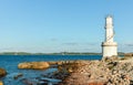 Empty beach of tourists and high lighthouse on Formentera Island. Royalty Free Stock Photo
