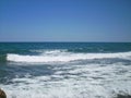 an empty beach with waves Royalty Free Stock Photo