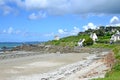 Empty beautiful beach near Dinan with some traditional buildings. Brittany, France