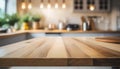 Empty, beautiful wood table top and blur bokeh modern kitchen interior background in clean and bright Royalty Free Stock Photo