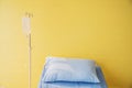 Empty bed with pillow and blanket and intravenous IV stand, Sodium Chloride Solution for Intravenous, The brine, Royalty Free Stock Photo