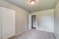 Empty bedroom bright walls gray carpet real estate