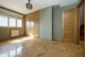 empty bedroom with fitted wardrobes oak parquet flooring green Royalty Free Stock Photo