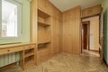 Empty bedroom with herringbone oak parquet, fitted wardrobes, desk Royalty Free Stock Photo