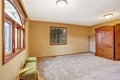 Empty bedroom interior in soft peach color with ottoman and ward