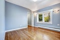 Empty bedroom with light blue walls