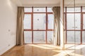 Empty bedroom with no view glass wall, red anodized aluminum windows and wardrobe with mirror doors and lock Royalty Free Stock Photo