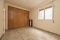 Empty bedroom stone floors, fitted wardrobes and chests Royalty Free Stock Photo