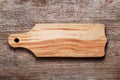 Empty beech cutting board with space for text on wood texture background Royalty Free Stock Photo
