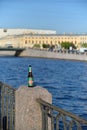 Empty beer bottle on granite embankment fence Fontanka