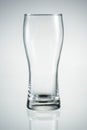 Empty beer glass with reflection isolated. Royalty Free Stock Photo
