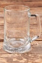 Empty beer mug isolated on wooden background. Royalty Free Stock Photo