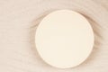 Empty beige round platform podium for cosmetics or products presentation on natural beige beach sand background. Wavy Royalty Free Stock Photo