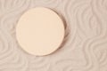 Empty beige round platform podium mockup for beauty cosmetics or products presentation on natural white beach sand Royalty Free Stock Photo