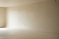 Empty beige studio corner with soft light background Royalty Free Stock Photo