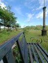 Empty bench in abandoned park Royalty Free Stock Photo