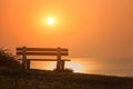 Empty bench with amazing sunrise sea view, peace and calm romantic travel background Royalty Free Stock Photo