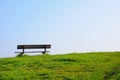 Empty bench on a green grass Royalty Free Stock Photo