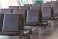 empty bench in the hall at international airport Royalty Free Stock Photo