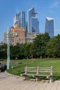 Empty Bench at Hudson River Park with the Hudson Yards Skyline in the Background during the Summer in New York City Royalty Free Stock Photo