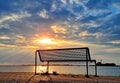 Empty bench at the IJsselmeer at sunset Royalty Free Stock Photo