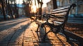Empty Bench Illuminated by Sunset Light Evokes Bittersweet Emotions in a Quiet Park Setting Royalty Free Stock Photo