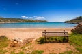 Empty bench at Marathi bay beach on Crete Royalty Free Stock Photo