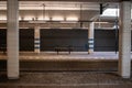 An empty bench on one of the platforms of Station Rijswijk The Netherlands Royalty Free Stock Photo