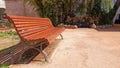 Empty bench in the park on a beautiful sunny day without people Royalty Free Stock Photo