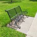 empty bench in park on bright day Royalty Free Stock Photo