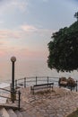 empty bench at sea beach on sunset Royalty Free Stock Photo