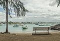 An empty bench on the shore of the Grand Bay