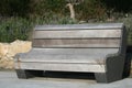 Empty bench on a sidewalk Royalty Free Stock Photo