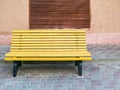 Empty bench in the street outside. Urban background. Rest and relaxation Royalty Free Stock Photo