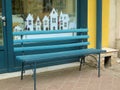 Empty bench in the street outside. Urban background. Rest and relaxation Royalty Free Stock Photo