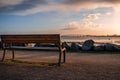 Empty bench at sunrise with the bridge of Ile de Re in the background. tranquility concept