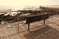 Empty bench with view of stony coastline Royalty Free Stock Photo